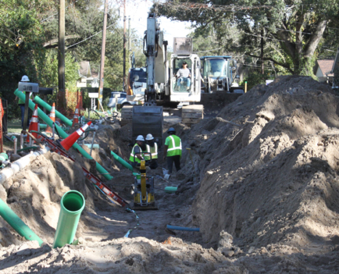 Crews install sewer pipe on Crest Avenue.