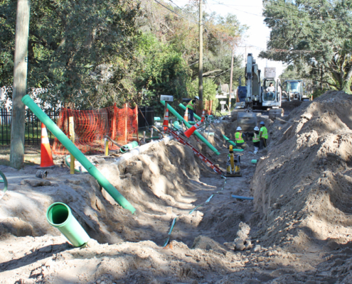 Crews excavate Crest Avenue to install new sewer lines.