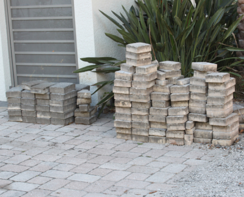 Pavers from resident's drive has been removed and stacked, to be replaced when construction is completed.